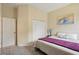 A comfortable guest bedroom featuring carpet, a closet, and blue accents at 6758 Hillis Dr, Lakeland, FL 33813