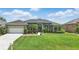 Charming single-story home with lush landscaping, manicured lawn, and inviting curb appeal at 6758 Hillis Dr, Lakeland, FL 33813