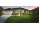 Charming single-story home boasts lush landscaping, mature palms, and a well-manicured lawn at 6758 Hillis Dr, Lakeland, FL 33813