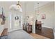 Bright foyer features a decorative front door, high ceilings, and elegant decor at 6758 Hillis Dr, Lakeland, FL 33813
