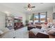 The living room features a leather sectional couch, an ottoman, an area rug, large windows and recessed lighting at 6758 Hillis Dr, Lakeland, FL 33813