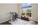 Cozy home office with a large window, hardwood floors, and built in shelving at 6758 Hillis Dr, Lakeland, FL 33813