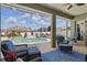 Screened lanai with a sparkling swimming pool, lounge chairs, and lush landscaping offering a private oasis at 6758 Hillis Dr, Lakeland, FL 33813