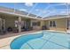 Enjoy this beautiful pool with screened-in lanai, outdoor seating, and a built-in grill for entertaining at 6758 Hillis Dr, Lakeland, FL 33813