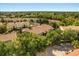Wide aerial view of a condo community featuring mature trees and lush landscaping at 676 Sandy Neck Ln # 102, Altamonte Springs, FL 32714
