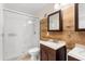 Updated bathroom features a white shower, tile flooring, and vanity with double sinks at 676 Sandy Neck Ln # 102, Altamonte Springs, FL 32714