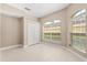 Bedroom with large window, closet and light neutral colors at 676 Sandy Neck Ln # 102, Altamonte Springs, FL 32714