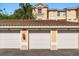 Garage unit with white doors under a clay tile roof at 676 Sandy Neck Ln # 102, Altamonte Springs, FL 32714