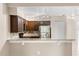 Modern kitchen features stainless steel appliances and breakfast bar at 676 Sandy Neck Ln # 102, Altamonte Springs, FL 32714