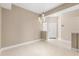 Open-concept living room with tile floors and modern lighting fixtures at 676 Sandy Neck Ln # 102, Altamonte Springs, FL 32714