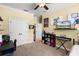 This bedroom has a study space, entertainment center, and good closet space at 724 Wildmere Village Cv, Longwood, FL 32750