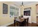 Cozy breakfast nook featuring a dark wood table, seating for four, and decorative accents at 724 Wildmere Village Cv, Longwood, FL 32750