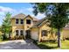 Attractive home featuring lush landscaping, and a quaint front porch at 724 Wildmere Village Cv, Longwood, FL 32750