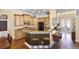Modern kitchen featuring a breakfast bar, stainless steel appliances, and stylish cabinetry at 724 Wildmere Village Cv, Longwood, FL 32750