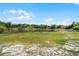 Picturesque lake surrounded by lush greenery, creating a serene and natural backdrop at 724 Wildmere Village Cv, Longwood, FL 32750