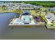 Stunning aerial view of community pool, clubhouse, playground, and parking, all set against the backdrop of a tranquil lake at 765 Terrapin Dr, Debary, FL 32713
