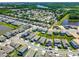 Wide aerial shot showcasing a community with neatly arranged houses, manicured lawns, and waterfront views at 765 Terrapin Dr, Debary, FL 32713