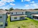 A high angle view of a home's manicured backyard and covered patio in a residential neighborhood at 765 Terrapin Dr, Debary, FL 32713