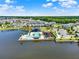 Comprehensive aerial perspective of community amenities including a pool and clubhouse on a lakefront setting at 765 Terrapin Dr, Debary, FL 32713