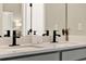 Bathroom featuring double sinks, quartz countertop, modern fixtures and decor at 765 Terrapin Dr, Debary, FL 32713