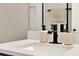 Contemporary bathroom vanity featuring a white countertop, sleek faucet, and stylish accessories at 765 Terrapin Dr, Debary, FL 32713