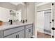 Bathroom featuring double sinks, quartz countertop, modern fixtures and a tub shower at 765 Terrapin Dr, Debary, FL 32713