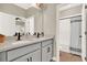 Bathroom featuring double sinks, quartz countertop, modern fixtures and a tub shower at 765 Terrapin Dr, Debary, FL 32713