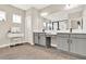 This bathroom features dual sinks, a vanity, and tile flooring at 765 Terrapin Dr, Debary, FL 32713