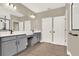This bathroom has dual sinks, a vanity, and tile flooring at 765 Terrapin Dr, Debary, FL 32713