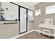 Bright bathroom with a glass-enclosed shower and a vanity table at 765 Terrapin Dr, Debary, FL 32713