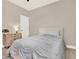 Bedroom features ceiling fan, neutral walls, carpet, and a wood nightstand with lamp at 765 Terrapin Dr, Debary, FL 32713