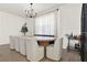Modern dining room with large table and sleek design, adjacent to a bar cart at 765 Terrapin Dr, Debary, FL 32713