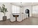 Elegant dining room with modern lighting, stylish chairs, and sophisticated decor at 765 Terrapin Dr, Debary, FL 32713