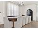 Bright dining room features modern chandelier and dining seating at 765 Terrapin Dr, Debary, FL 32713