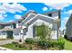 A two-story home with a well-manicured lawn and brick driveway is complemented by stone veneer accents at 765 Terrapin Dr, Debary, FL 32713