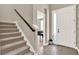 Inviting foyer with staircase and tile flooring, leading into the home's interior at 765 Terrapin Dr, Debary, FL 32713