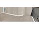 Upstairs hallway with carpet flooring and iron railing at 765 Terrapin Dr, Debary, FL 32713