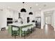 The open-concept kitchen features a large island with seating, modern appliances, and a bright, airy atmosphere at 765 Terrapin Dr, Debary, FL 32713