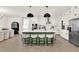 The expansive kitchen features a large center island with bar seating, stainless appliances, and modern lighting at 765 Terrapin Dr, Debary, FL 32713