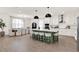 Spacious open kitchen featuring a large island with seating, modern appliances, and a bright dining area at 765 Terrapin Dr, Debary, FL 32713