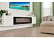 Close-up of living room with mounted fireplace, modern decor, and cozy ambiance at 765 Terrapin Dr, Debary, FL 32713