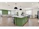 Open-concept living space with large kitchen island and comfortable living room, perfect for modern living and entertaining at 765 Terrapin Dr, Debary, FL 32713