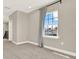 Bright loft space featuring carpet, white trim and baseboards, with a view to neighborhood at 765 Terrapin Dr, Debary, FL 32713