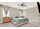 This bedroom has a ceiling fan and neutral colored walls with carpet at 765 Terrapin Dr, Debary, FL 32713