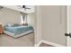 This main bedroom has a ceiling fan and neutral walls with carpeted floors at 765 Terrapin Dr, Debary, FL 32713