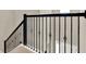 Elegant staircase features dark wood railing with decorative black iron spindles at 765 Terrapin Dr, Debary, FL 32713