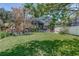 Expansive backyard featuring a screened-in patio, lush green grass, and ample space for outdoor activities at 821 N Lake Claire Cir, Oviedo, FL 32765