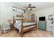 Main bedroom with a four-poster bed, tile floor, and neutral walls at 821 N Lake Claire Cir, Oviedo, FL 32765