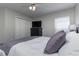 Relaxing bedroom view showcasing a comfortable bed, dresser, and closet space at 821 N Lake Claire Cir, Oviedo, FL 32765