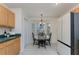 Cozy breakfast nook features a charming bay window and adjacent kitchen at 821 N Lake Claire Cir, Oviedo, FL 32765